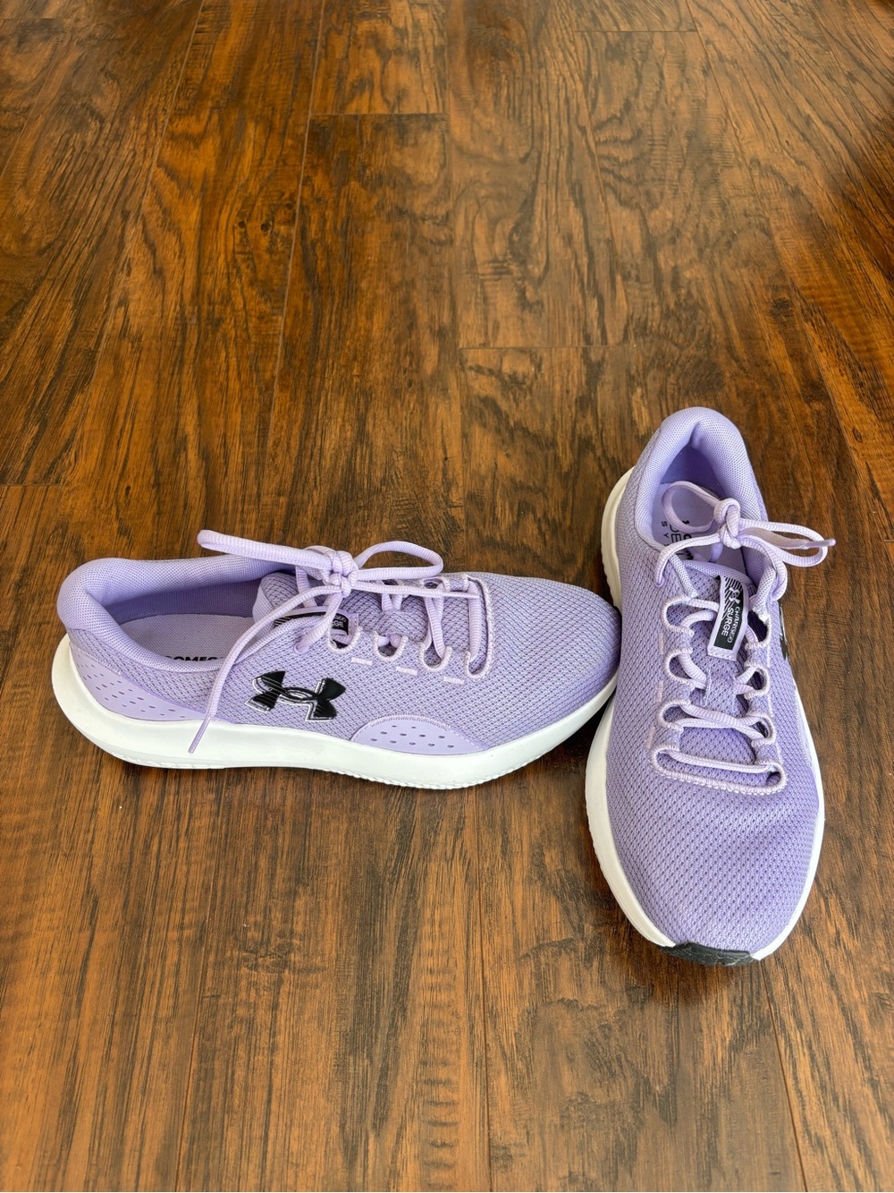Under Armour Women's Lavender Lightweight Running Shoes Charged Surge 11